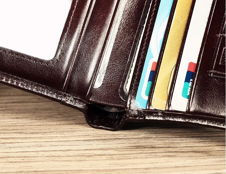 Men's leather wallet showing internal compartments for banknotes, cards, coins, and documents