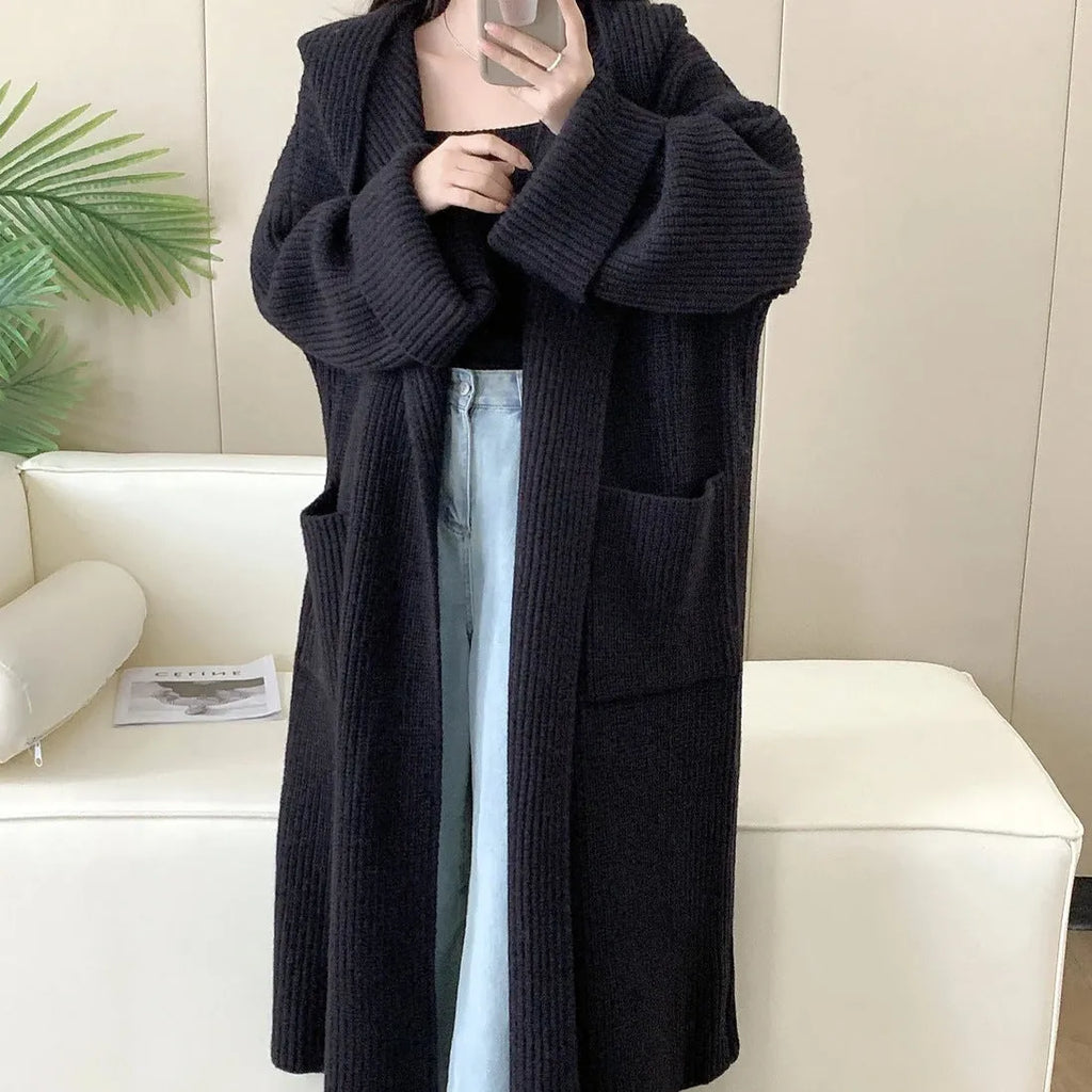 Women's loose hooded cardigan coat in acrylic fabric with raglan sleeves.