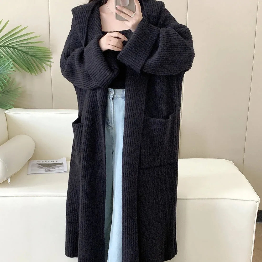 Women's loose hooded cardigan coat in acrylic fabric with raglan sleeves.