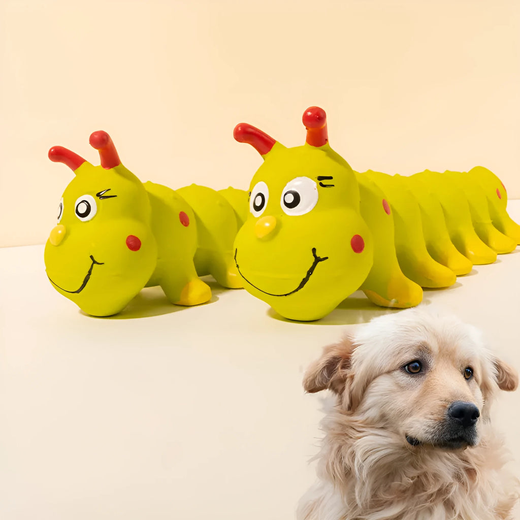 Yellow caterpillar-shaped rubber dog squeaky chew toy on a white background.
