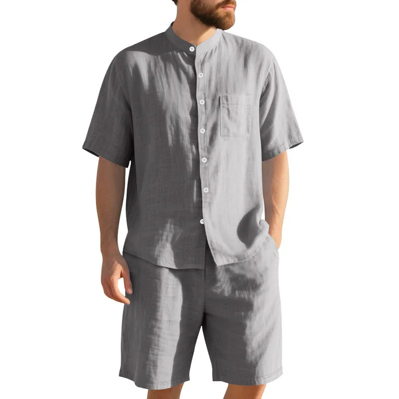 Men's light blue short sleeve linen shirt and shorts two-piece casual suit set on a hanger.