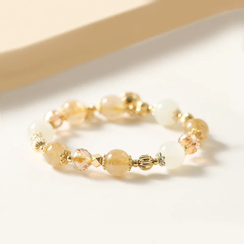 Gold tone rutilated quartz bracelet with electroplated finish and Korean style design