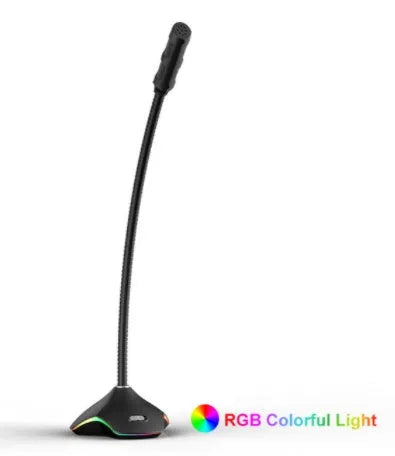 Black wired condenser microphone with built-in stand and pop filter sponge on a desk.