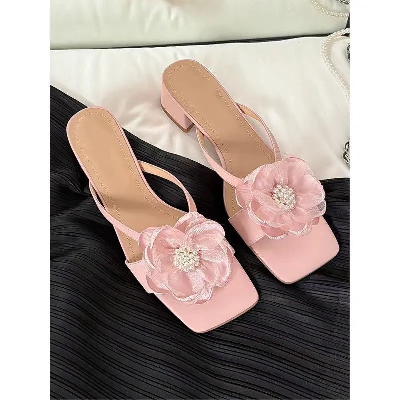 Women's cream-white satin sandals with a chunky block heel, square toe, and a single strap across the foot.