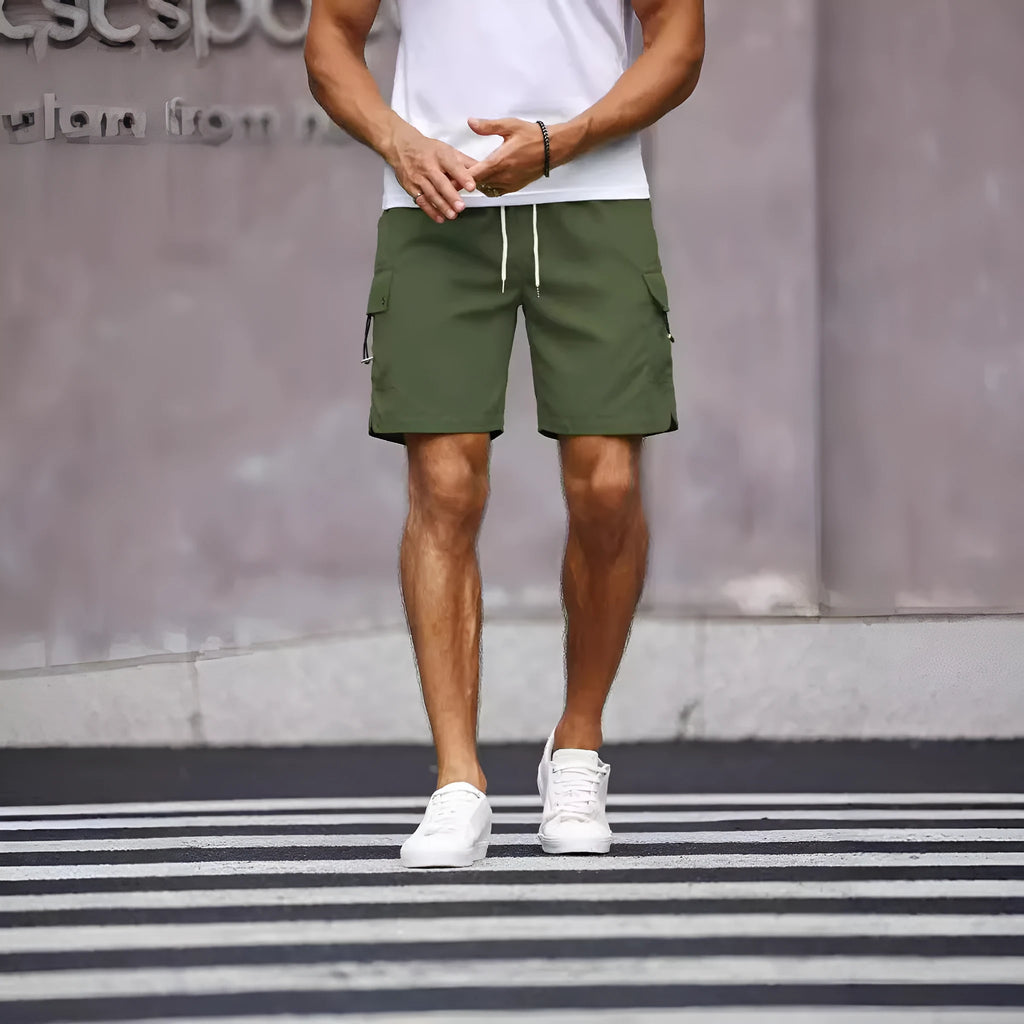 Men's loose fit workwear shorts in fluorescent green or army green with straight leg and fifth-pants length.
