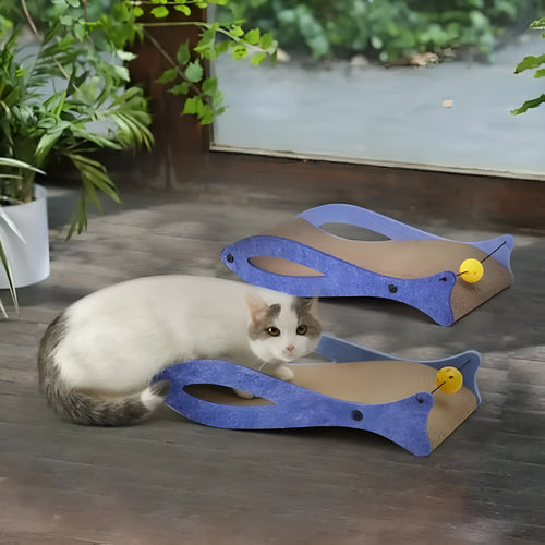 Blue fish-shaped cat scratcher pad with ball toy on elastic cord, cardboard construction with wavy lounge surface