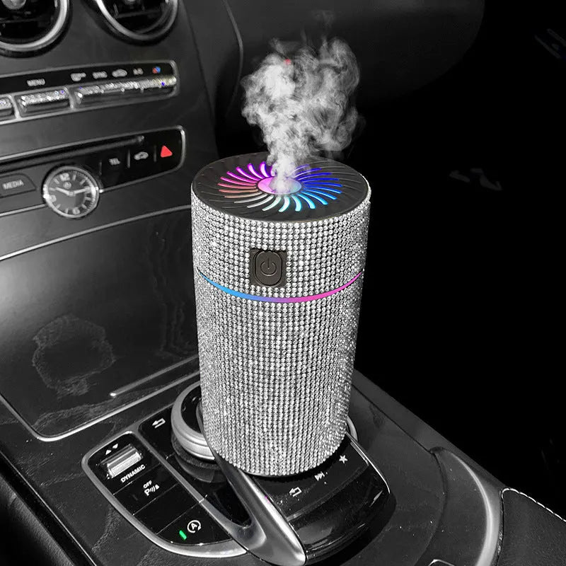 Compact white car air humidifier and purifier with USB cable on a car dashboard