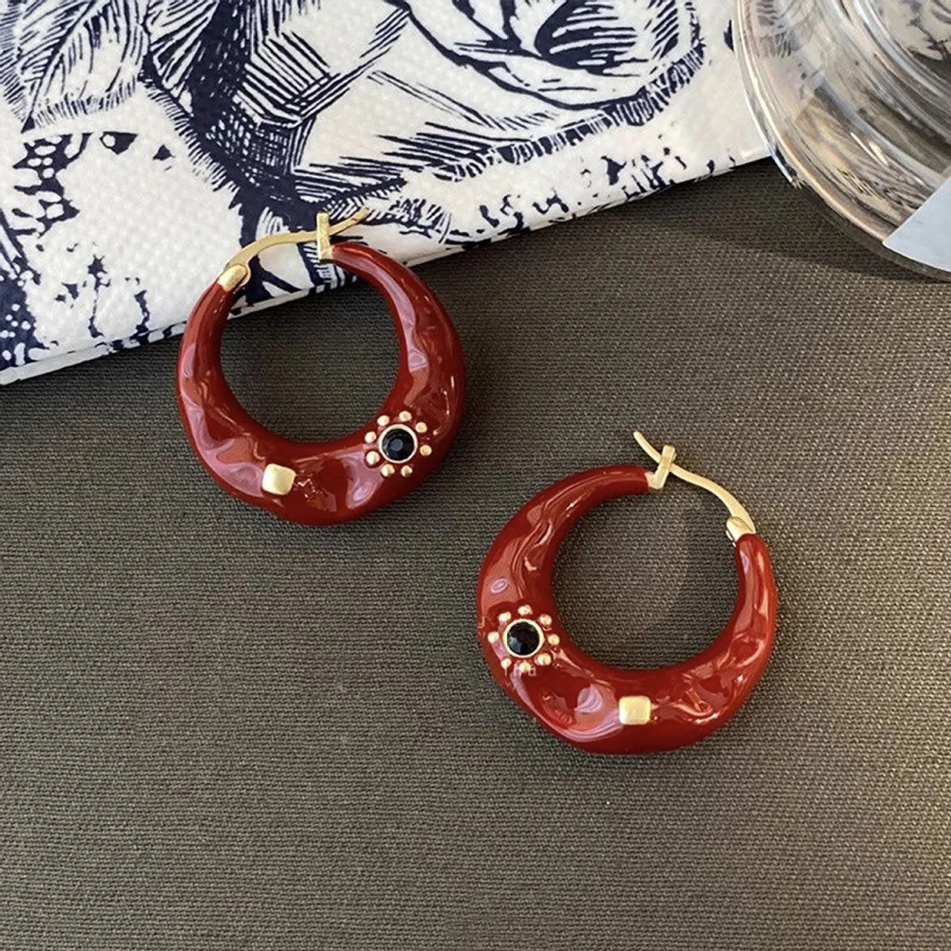 Hong Kong style retro ear studs with rhinestone decoration and dripping oil finish in black and red colour options