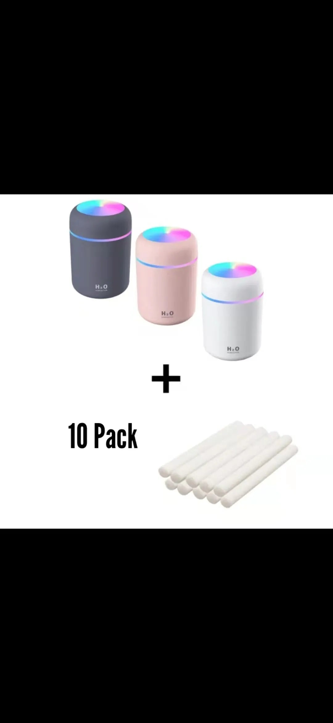 Pink USB desktop humidifier with colourful LED lights and 300ml water tank on wooden desk