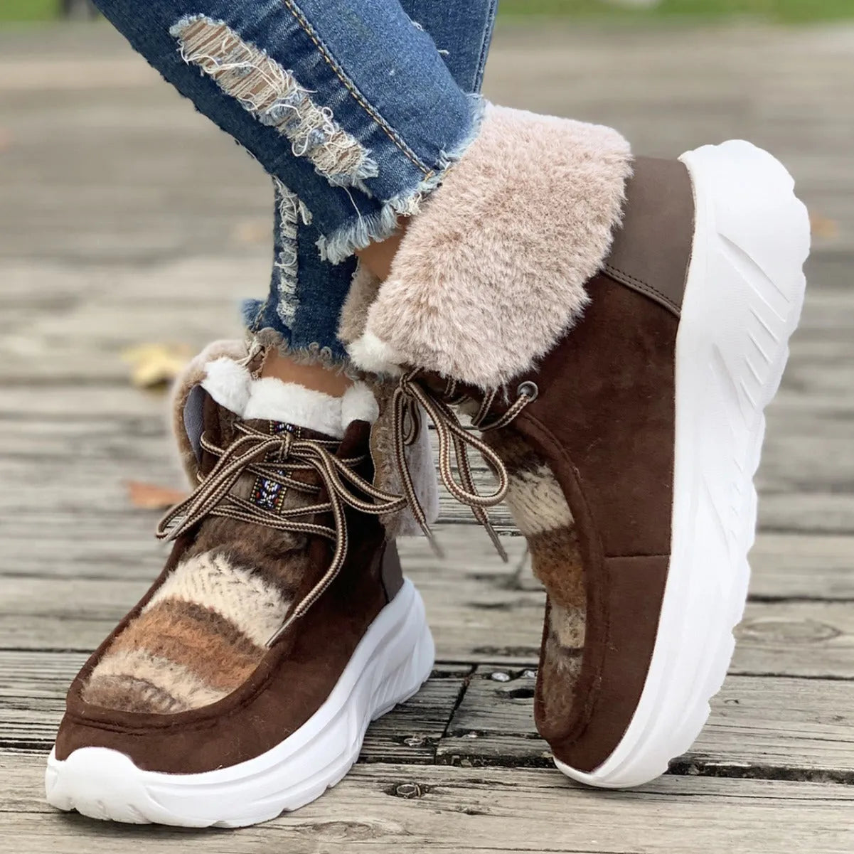 Women's lace-up snow boots with fuzzy suede upper, thermal plush lining, and thick rubber sole in beige colour