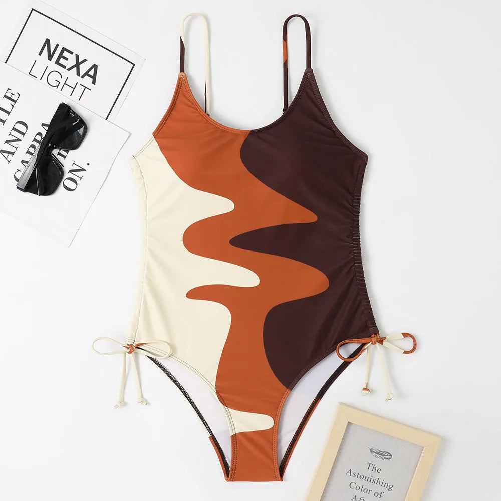 Women's blue sleeveless one-piece swimsuit with fixed trunks on a mannequin.