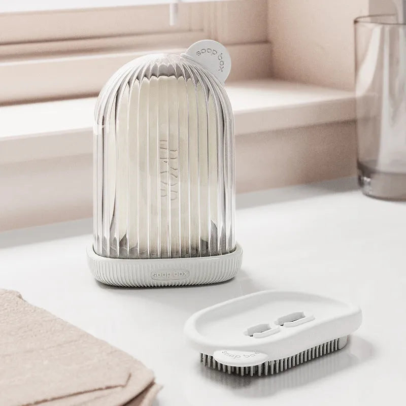 Compact PET travel soap dish in cream white, with a bar of soap on top