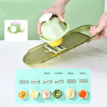 Transparent green multifunction vegetable cutter with stainless steel blades and 1.5L capacity chopping box