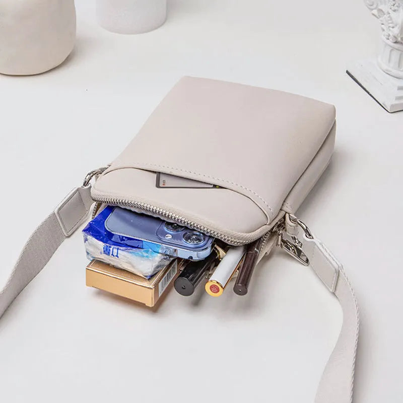 Solid colour PU leather mobile phone crossbody shoulder bag shown in beige.