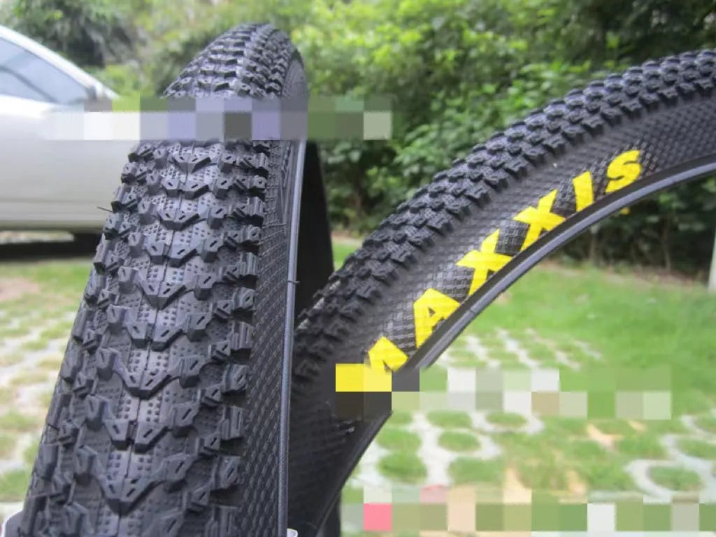 Ultralight puncture-proof mountain bike tyre shown in black with white label sidewall option.