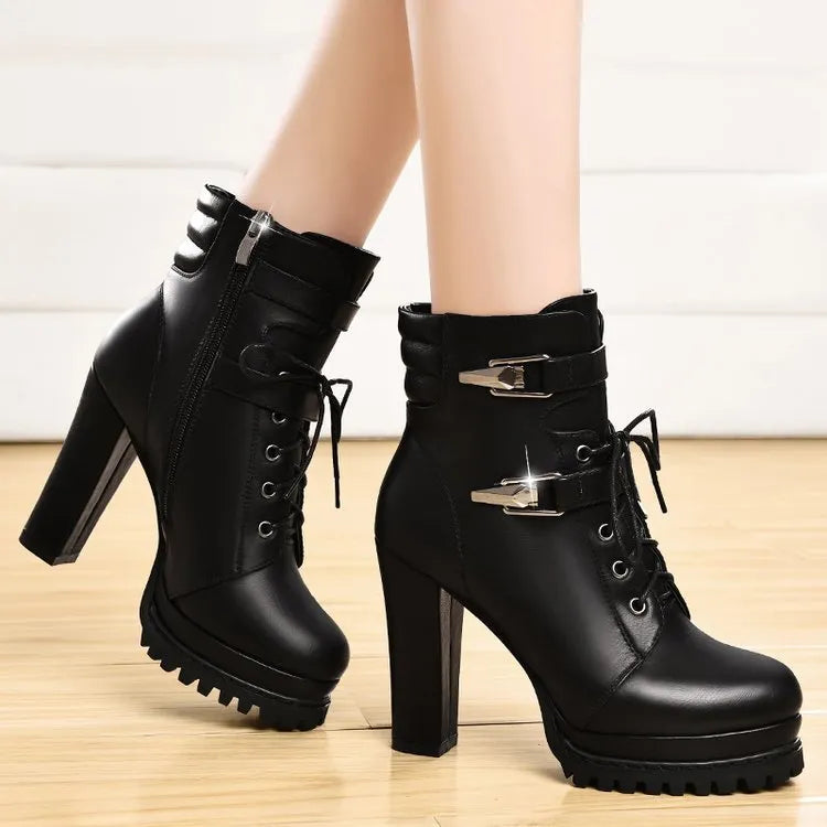 Black round toe thick heel women's high heel shoes with rubber sole on a white background
