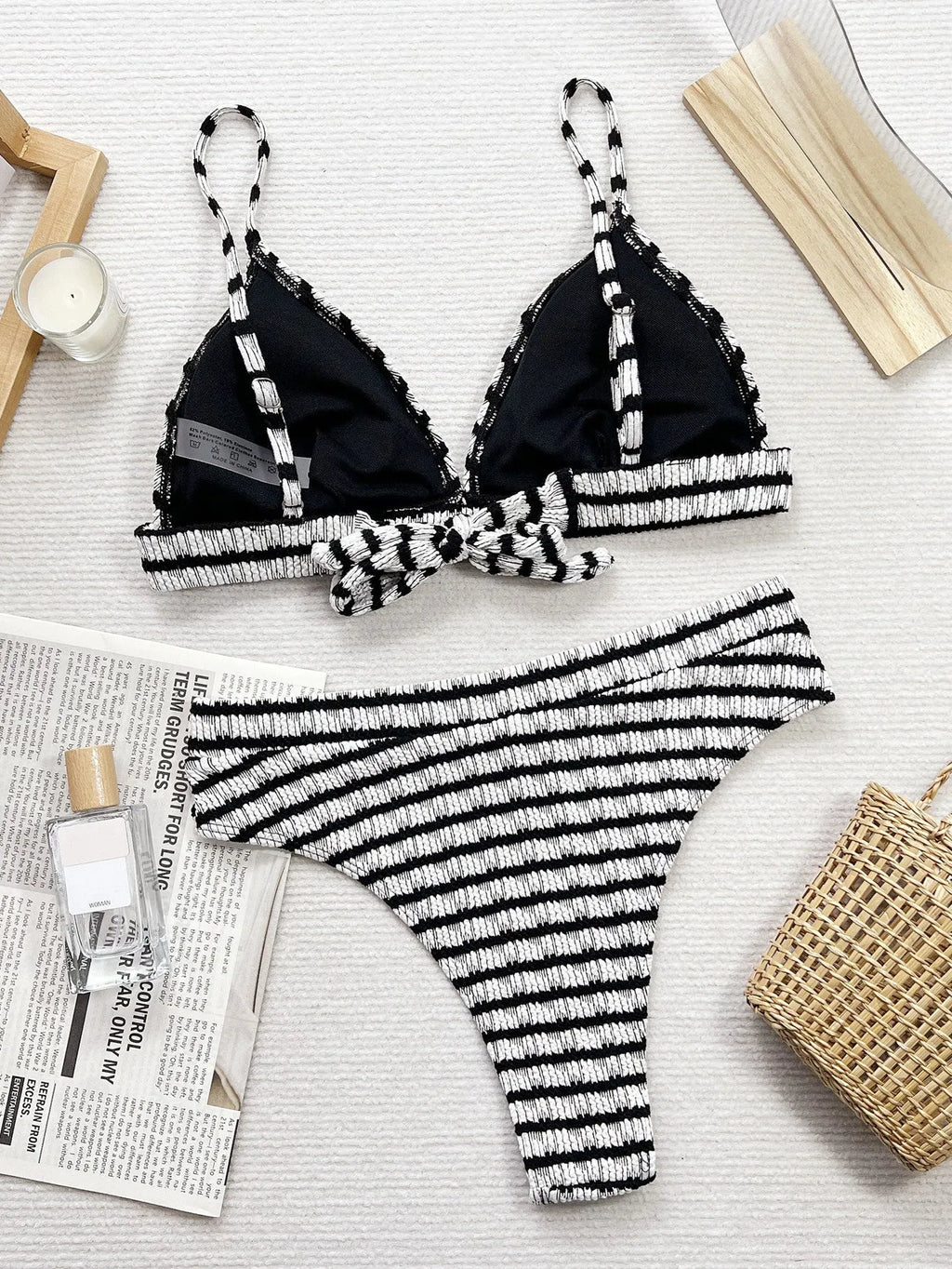 Black and white contrast women's separated bikini with brief bottom in solid colour pattern