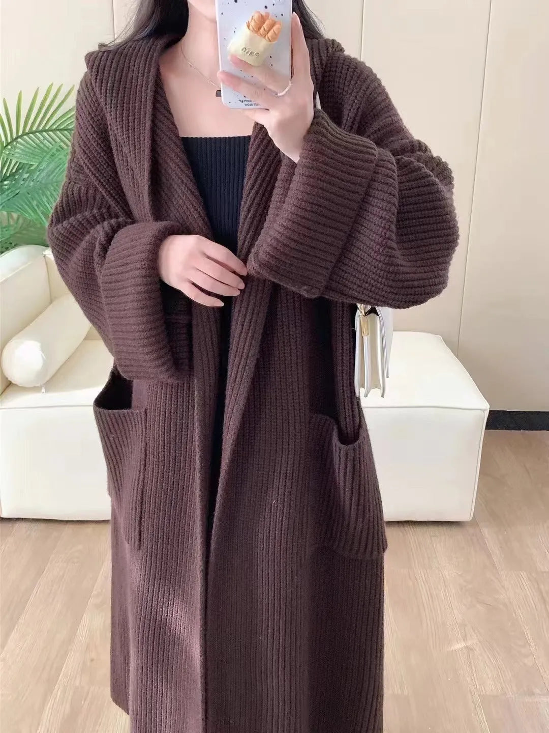 Women's loose hooded cardigan coat in acrylic fabric with raglan sleeves.