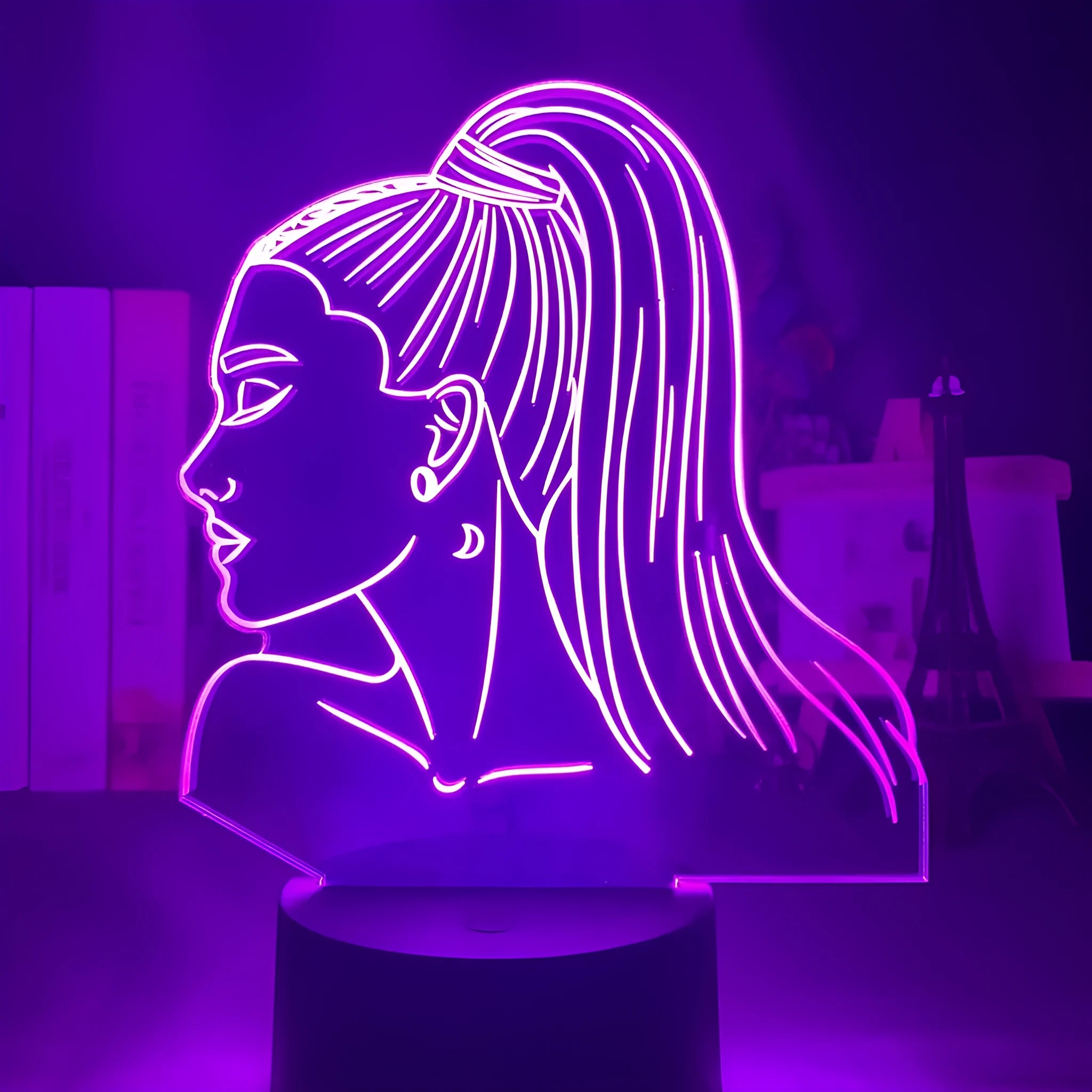 Slim black-based acrylic 3D LED night light showing colour display on wall