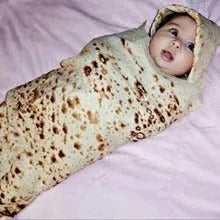 Round burrito design blanket in coral fleece flannel with tortilla print, folded to show size
