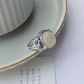 Adjustable copper vintage ring with white chalcedony colour and U-shaped open mouth design