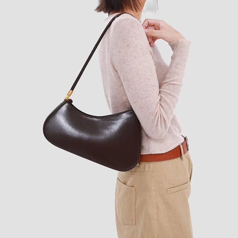 Women's retro oval underarm bag in PU with single strap and internal zip compartment, shown in multiple colour options