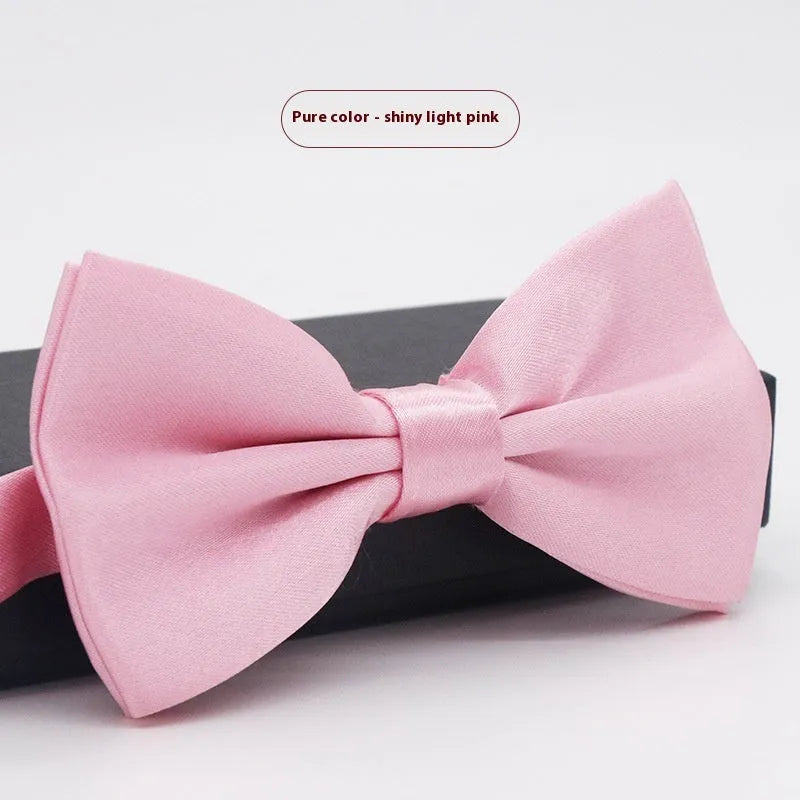 Solid colour flat head bow tie for formal wear in multiple colours including black, red, and blue.