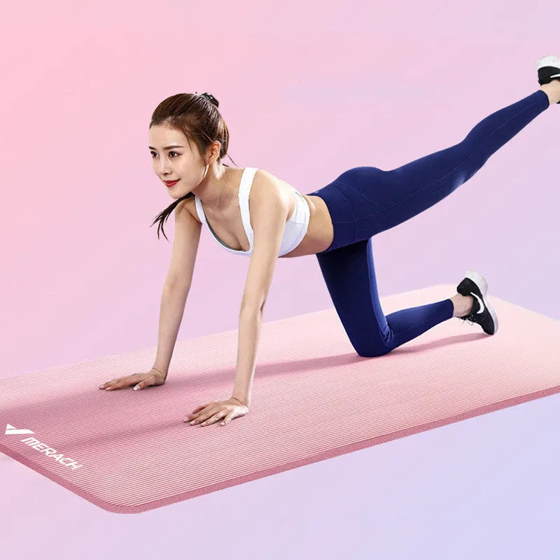 Widened blue TPE yoga mat 183x61cm on floor for home fitness stretching