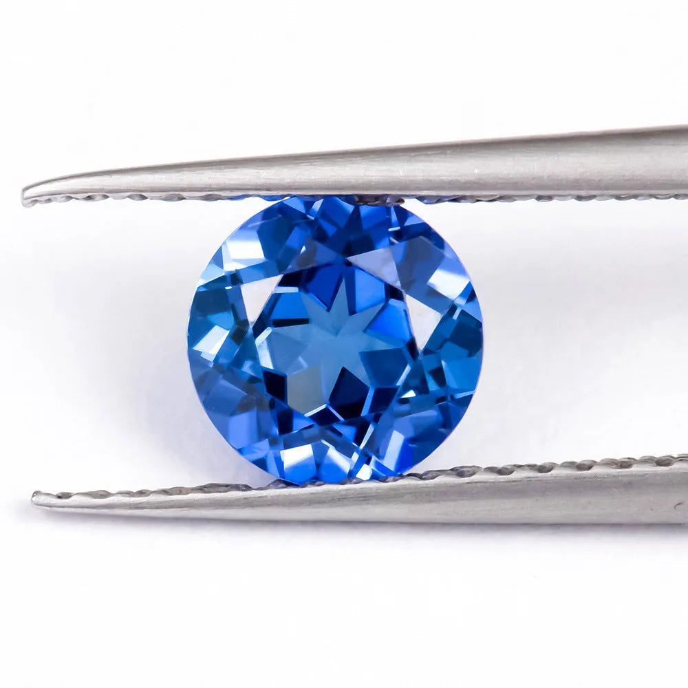Royal blue heart-shaped tiara design cultivated gemstone on a white background