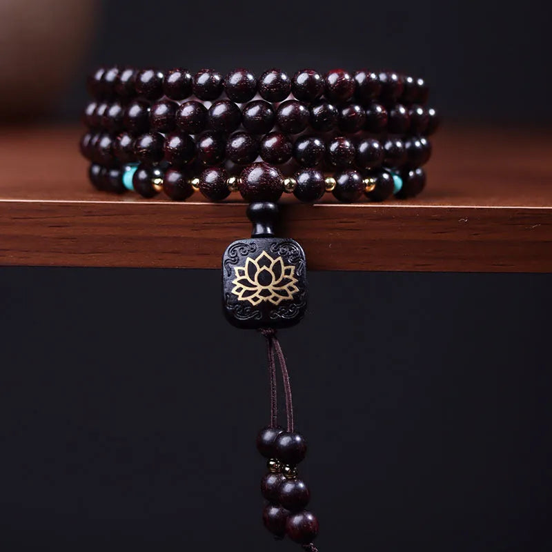 Zambian rosewood Buddha beads bracelet with flat lotus pendant showing 108 wooden beads