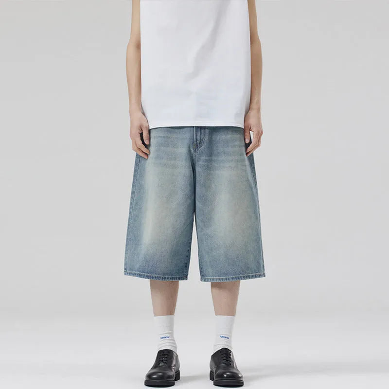 Men's loose straight-leg denim shorts in light blue colour showing cropped length and casual styling