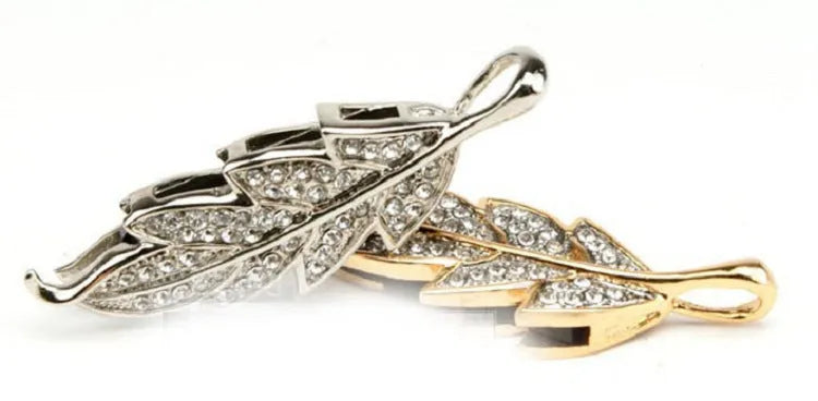 Silver metal USB flash drive with a crystal maple leaf decoration, showing front view.