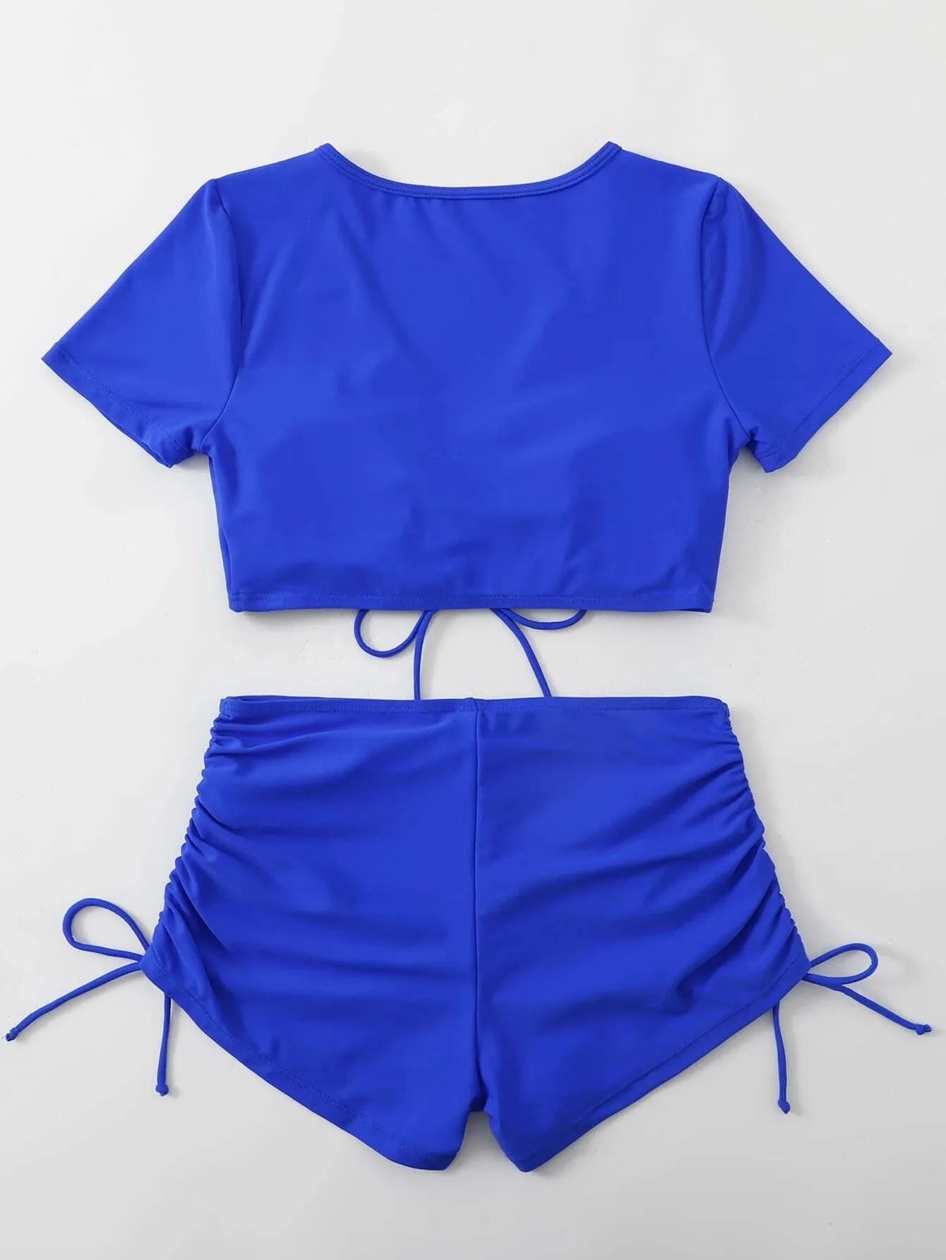 Women's lace-up bow two-piece swimsuit in dark green with separate top and shorts