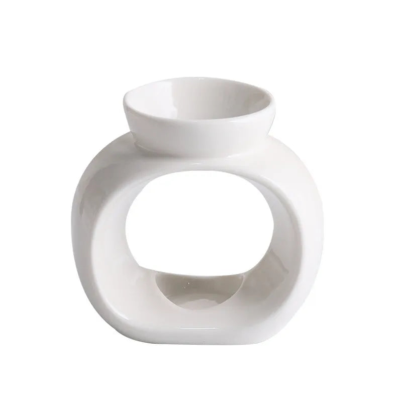 White ceramic Nordic style aromatherapy stove ornament with anti-dry burning design.