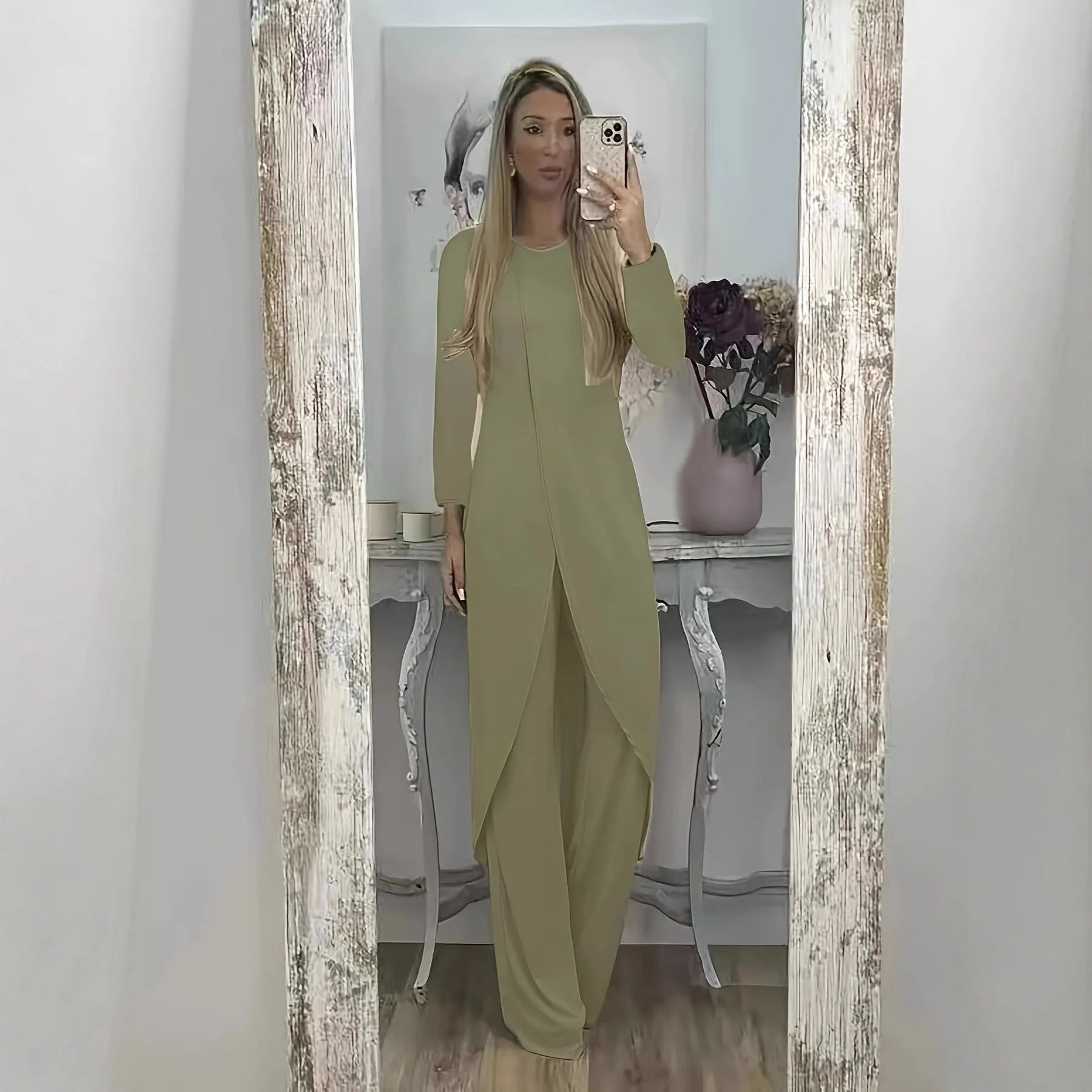 Casual black polyester two-piece lounge set with long sleeve top and loose trousers on a hanger.