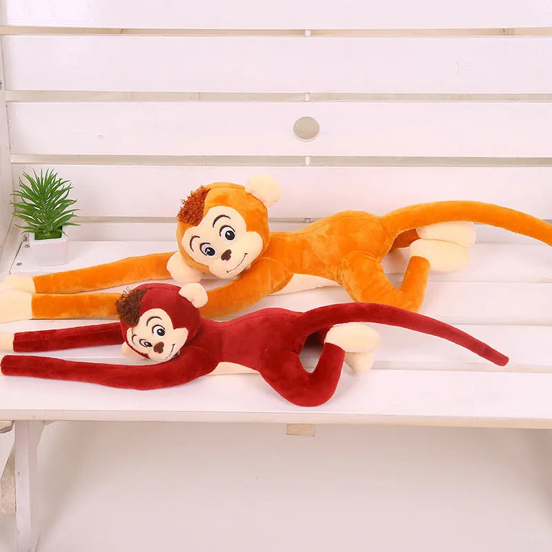 Soft plush monkey toy with long arms hanging from a curtain rod, available in 70cm and 90cm sizes and four colours