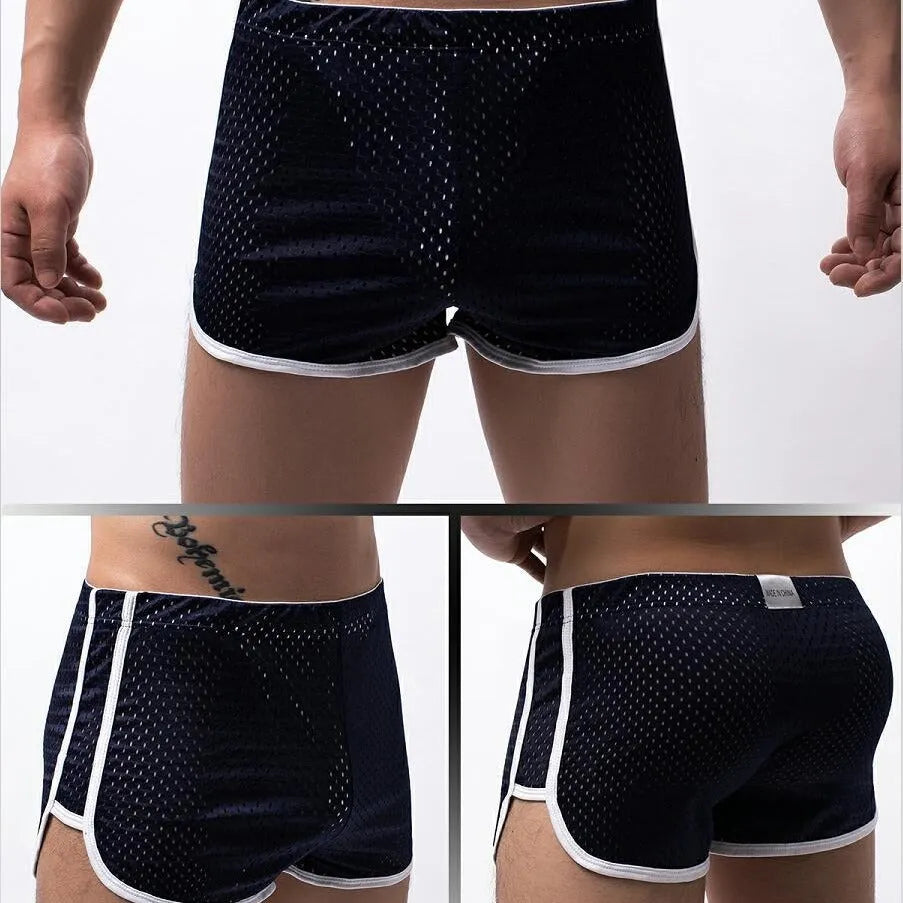 Men's knitted cotton three-point boxer shorts in black, grey, blue, and white colours laid flat.