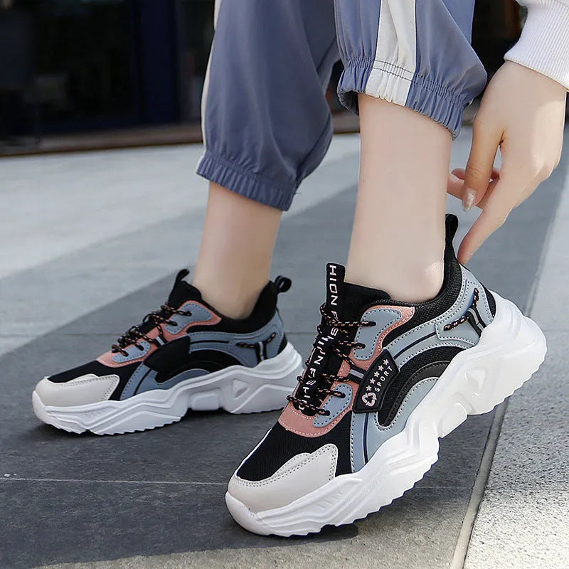 Women's white mesh casual sports shoes with thick PU sole, buckle detail, and a middle heel.