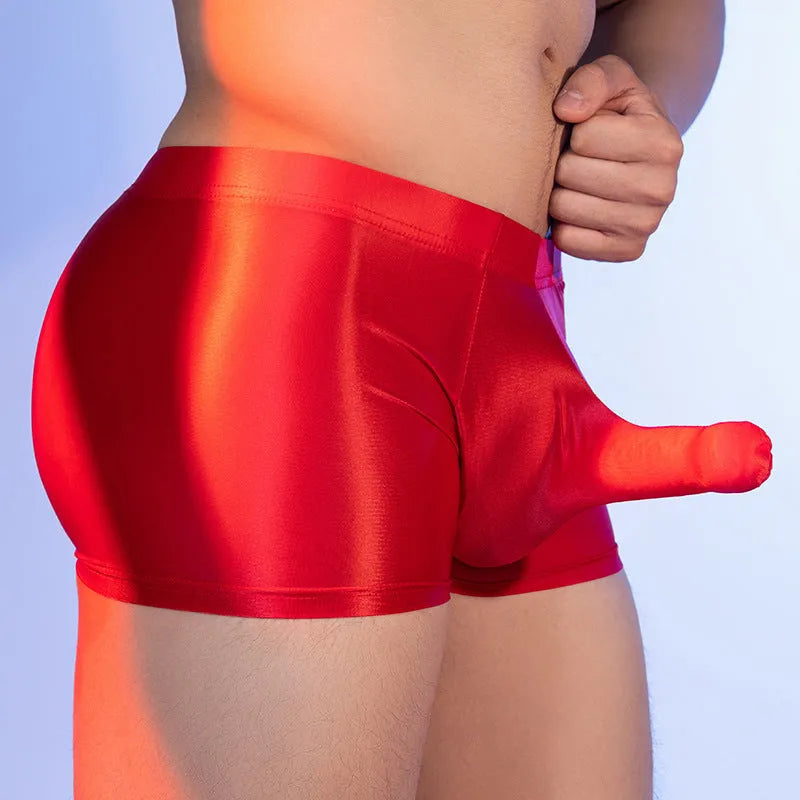 Men's red boxer shorts with an elephant nose print, made from seamless nylon fabric.