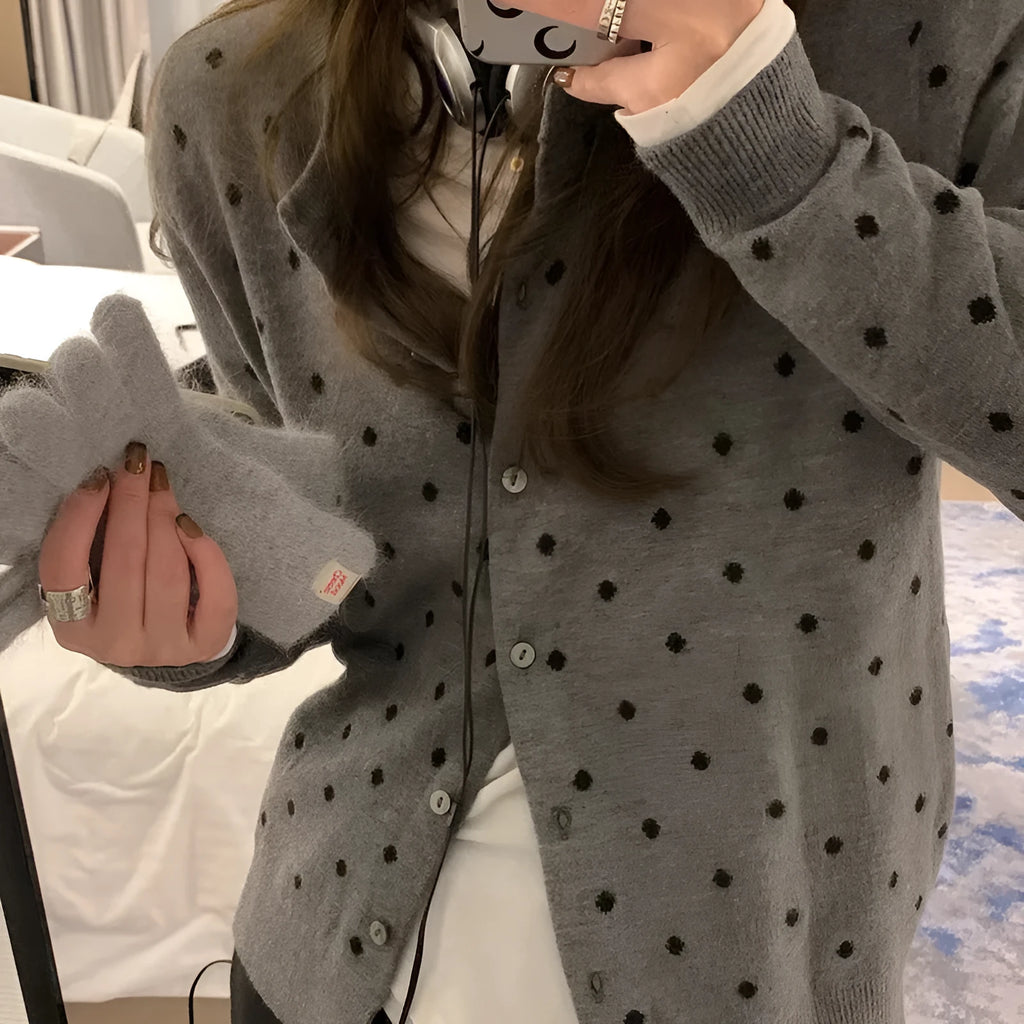 Women's gray dot pattern knitted cardigan with long sleeves and crocheted flower details