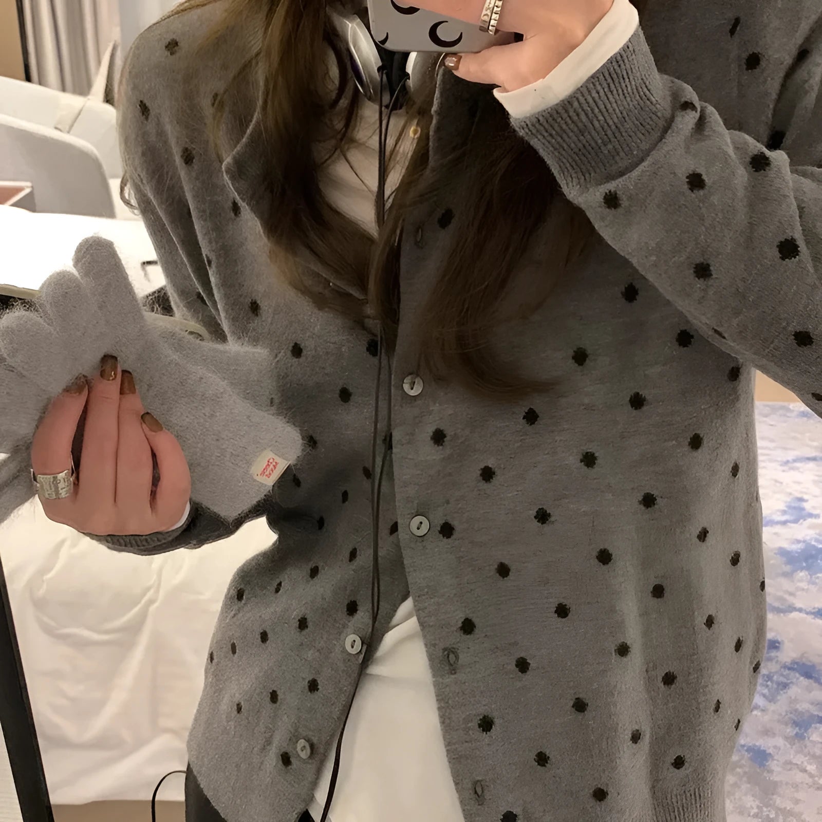 Women's gray dot pattern knitted cardigan with long sleeves and crocheted flower details