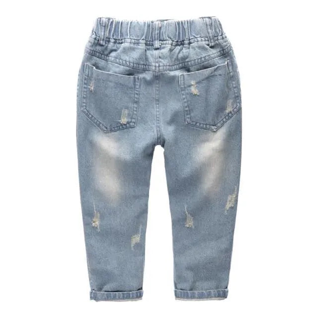 Light blue children's cotton skinny slim jeans laid flat showing slim leg and regular waist