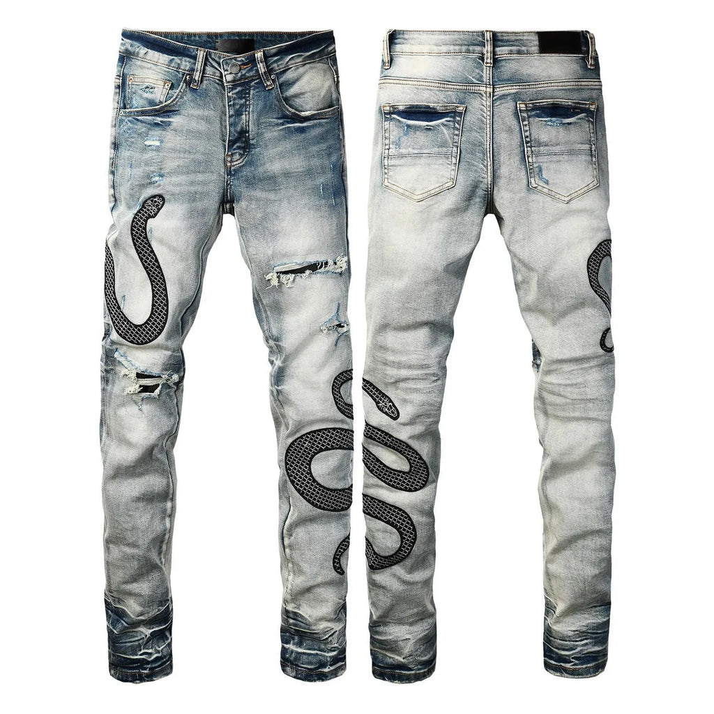 Close-up of wash distressed blue skinny jeans with a button fly and retro styling on a hanger.