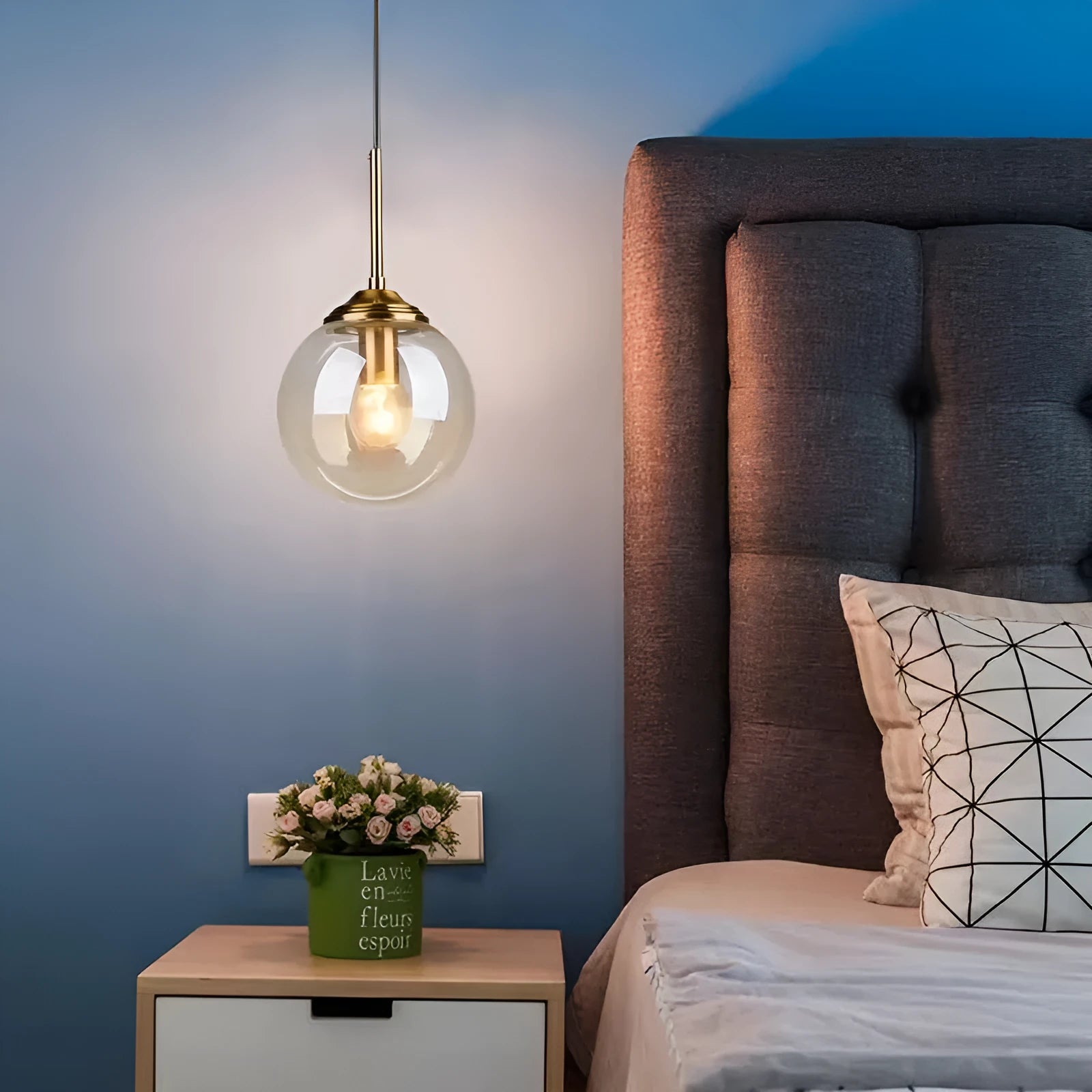 Modern round chandelier with glass balls in a Nordic style, mounted on a ceiling.