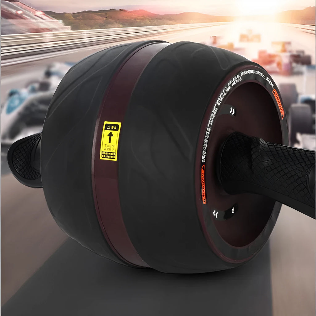 Home abdominal wheel in Black red with PP handle and spring boost mechanism on a flat surface