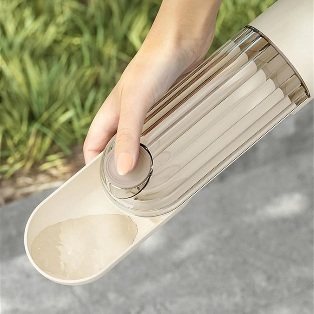 Beige foldable dog water bottle with food container base for outdoor use