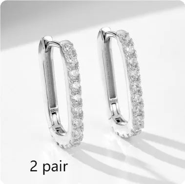 Sterling silver oval zircon ear clips with geometric design in white or yellow finish