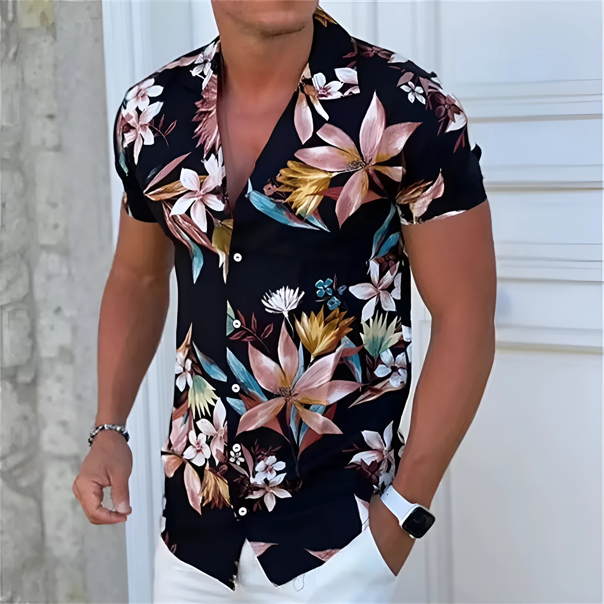 A man's loose-fitting short sleeve cardigan-style top with a colourful floral print.