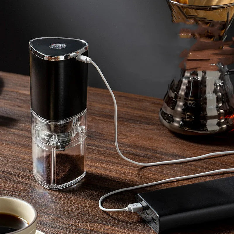 Frosted white electric coffee grinder with ceramic burr, USB-C port, and 25g capacity on a table