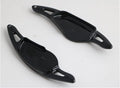Carbon fibre pattern steering wheel paddle shifters in black and red finishes